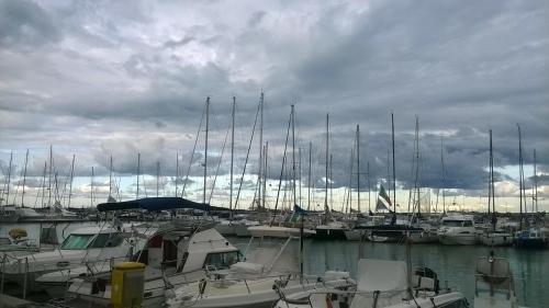a bunch of boats docked in a marina on a cloudy day at Hotel Gianna in Roseto degli Abruzzi