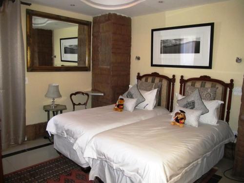 Katil atau katil-katil dalam bilik di Kosmos Manor Guest House