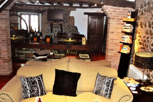 a living room filled with furniture and a fireplace at El Molino de Floren in Santo Domingo de la Calzada