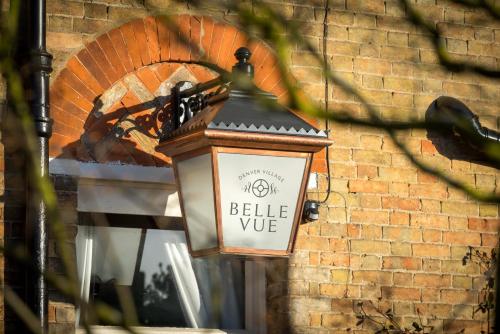 a street light hanging on a brick wall at Belle Vue Guest House in Denver