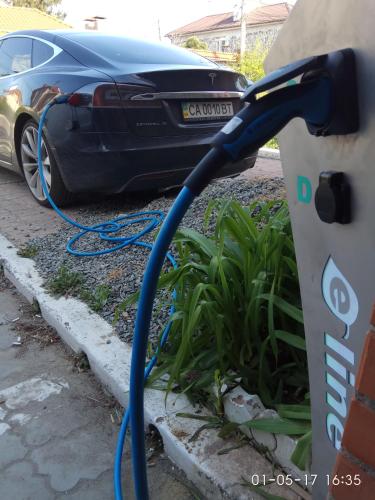 a car is hooked up to a car charger at ApartHotel Dom in Odesa