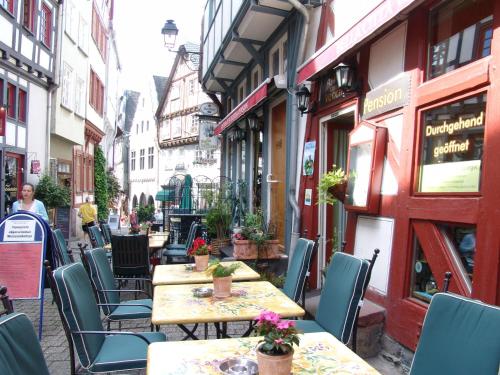 a group of tables and chairs in a street at Bella Citta Vecchia in Limburg an der Lahn