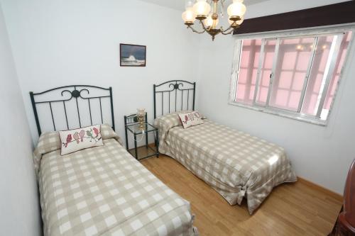 Postel nebo postele na pokoji v ubytování Santa catalina 46