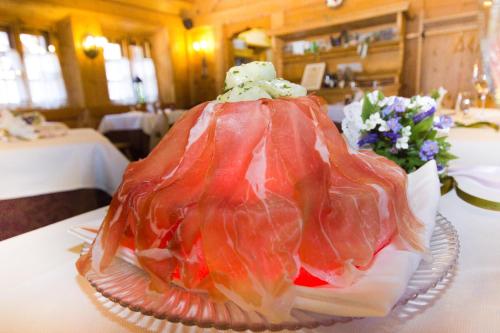 a cake sitting on top of a table at Hotel Edelhof in Tarvisio