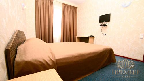 Cama o camas de una habitación en Premier Hotel Center