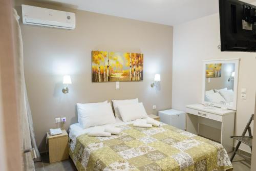 Ένα ή περισσότερα κρεβάτια σε δωμάτιο στο LUX Hotel