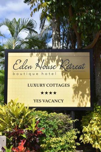 a sign for the elena house retreat boutique hotel at Eden House Retreat in Yungaburra
