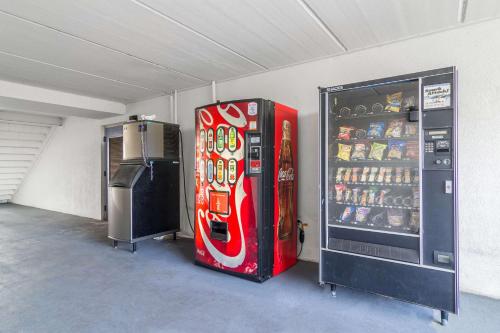 a coca cola vending machine in a garage at Motel 6 Waycross in Waycross