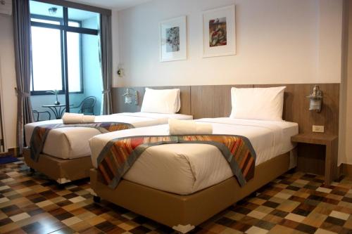 Un pat sau paturi într-o cameră la P-Residence