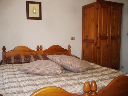 Ένα ή περισσότερα κρεβάτια σε δωμάτιο στο Albergo Passet