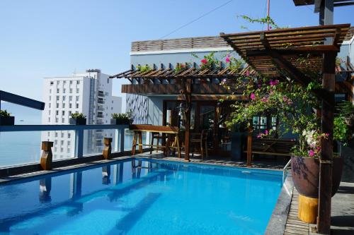 a swimming pool on the roof of a building at Seasing Boutique Hotel in Nha Trang