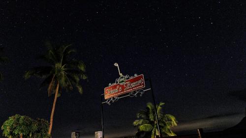 a sign for a kings seafood restaurant at night at Noni's Resort in Alitagtag