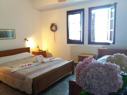 Postel nebo postele na pokoji v ubytování Dimosthenis Karastamatis Rooms