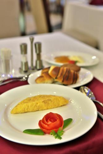 a table with two plates of food on a table at Sapphire Addis in Addis Ababa