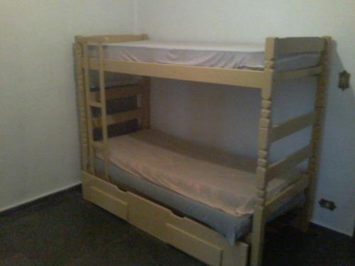 a set of bunk beds in a room at Apartamento na Praia Grande in Praia Grande
