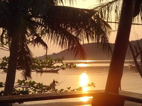 a view of a lake with a boat in the water at Beach House Cambodia in Koh Rong Sanloem