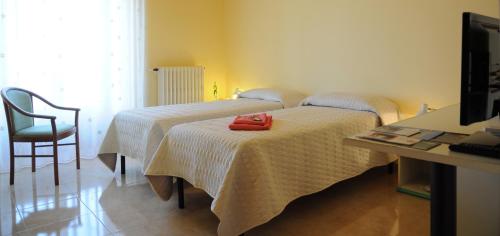 Postel nebo postele na pokoji v ubytování Albergo Villa Nobile