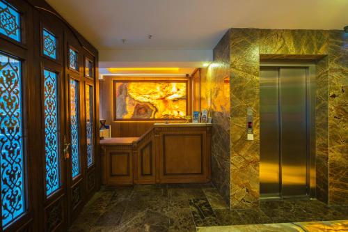 a bathroom with a sink and stained glass windows at Gulec Hotel & Spa - Special Category in Istanbul