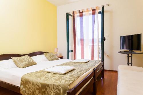 Postel nebo postele na pokoji v ubytování Apartments Marija