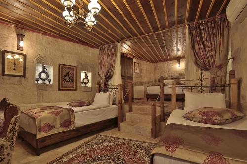 Кровать или кровати в номере Aren Cave Hotel And Art Gallery