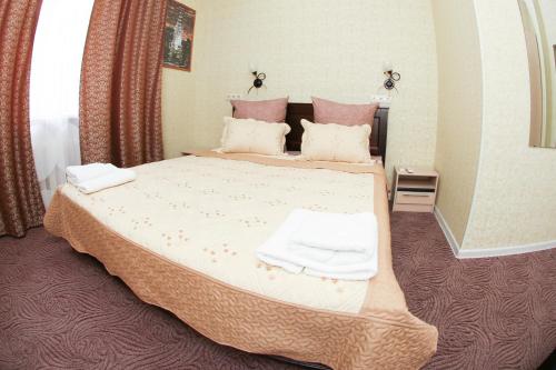 Кровать или кровати в номере Отель Олимп