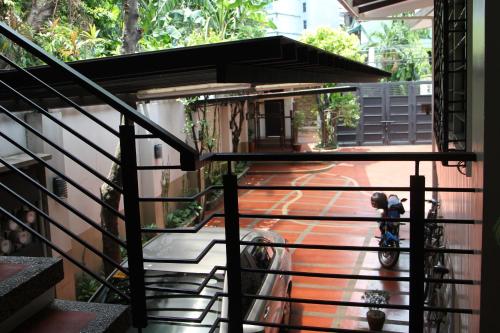 a person riding a bike down a stairs at New Manila Suites in Manila