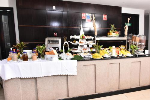 a table with a buffet of food on it at La Maison Royale in Nairobi