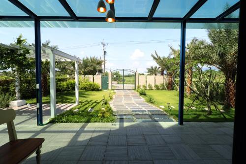 a view of a garden from the inside of a house at Zen Ocean in Jian