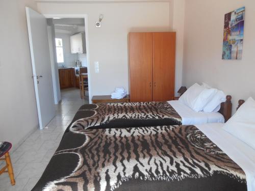 Postel nebo postele na pokoji v ubytování Molos Beach Apartments