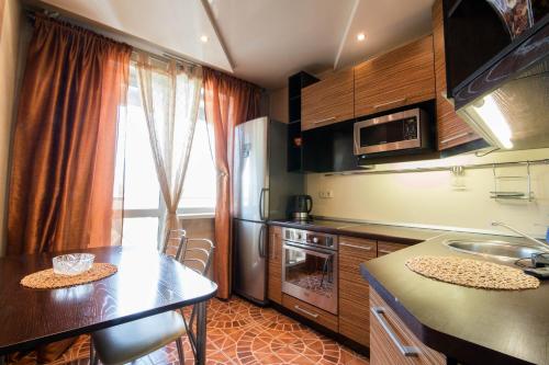 a kitchen with a sink and a counter top at Kirova 115 in Novokuznetsk