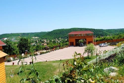 a view of a building with a parking lot at Rózsapark Vendégház in Demjén
