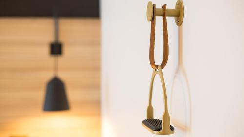 a pair of utensils hanging on a wall at ibis Styles Laval Centre Gare in Laval