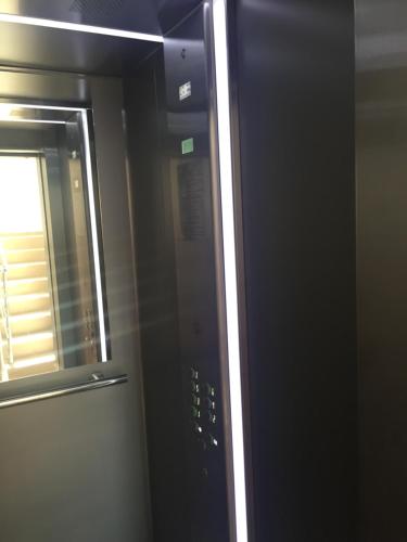 a microwave door with a window in a room at Beachfront Luxury Apartments Elizabeth, Pomorie in Pomorie