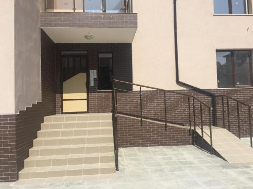 a set of stairs leading to a building at Beachfront Luxury Apartments Elizabeth, Pomorie in Pomorie