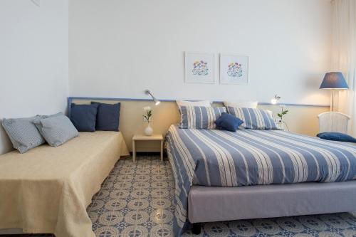 Letto o letti in una camera di Angelina Apartments Amalfi Coast