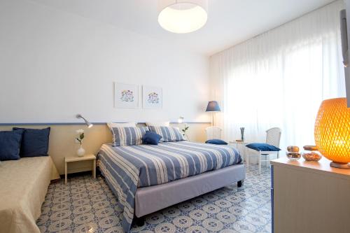 Letto o letti in una camera di Angelina Apartments Amalfi Coast