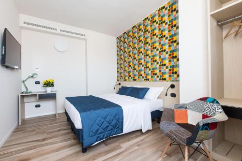 Säng eller sängar i ett rum på Aparthotel Isola