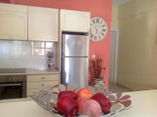 a bowl of fruit on a counter in a kitchen at Villa Sofia in Chrani