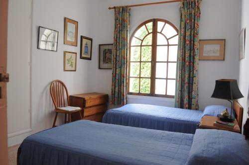 Giường trong phòng chung tại Villa Nora