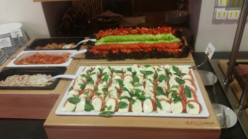 a buffet with a display of food on a table at Penzion Lípa in Krásná Lípa