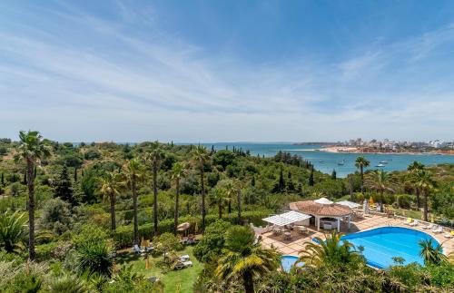 an aerial view of a resort with a swimming pool at Hotel Casabela in Ferragudo