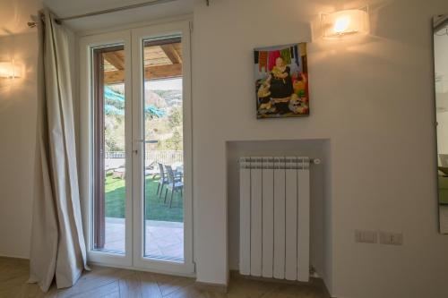 a room with a sliding glass door to a patio at Casa Rosanna in Maiori