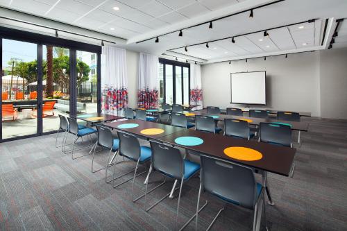 a conference room with a long table and chairs at Aloft El Segundo - Los Angeles Airport in El Segundo