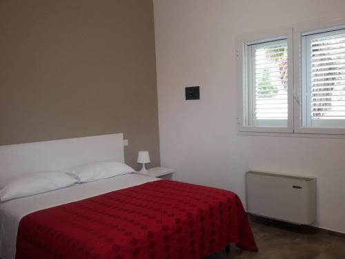 Letto o letti in una camera di Blu Salentino b&b con Parcheggio Privato Gratuito