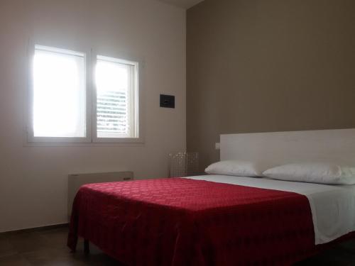 Letto o letti in una camera di Blu Salentino b&b con Parcheggio Privato Gratuito