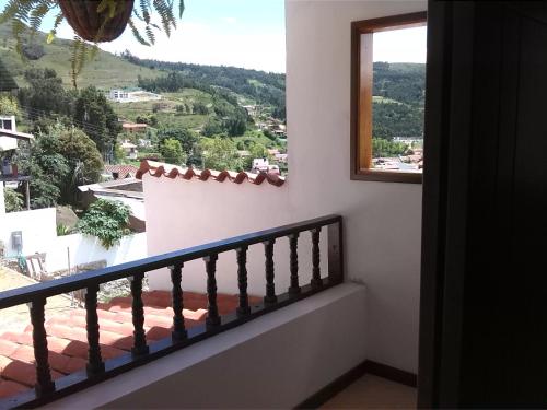 a balcony with a view of a mountain at San Benito Hotel in Tibasosa