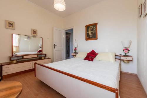 Ένα ή περισσότερα κρεβάτια σε δωμάτιο στο Apartments Kastelani