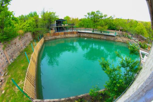 an overhead view of a large pool of blue water at Amiran's Lake in Tbilisi City
