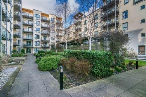 an apartment complex with a garden in front of a building at Edinburgh Old Town in Edinburgh