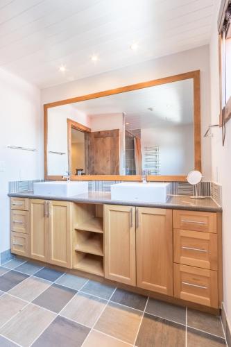 a kitchen with a large sink and a large mirror at Yukimi # 1 in Kutchan